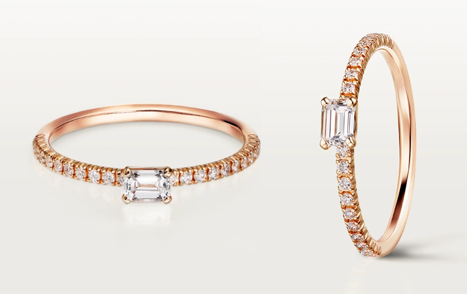 求婚戒指 此Étincelle de Cartier 玫瑰金求婚戒指，中央鑲嵌1顆重祖母綠式切割鑽石，周圍密鑲22顆明亮式切割圓鑽。